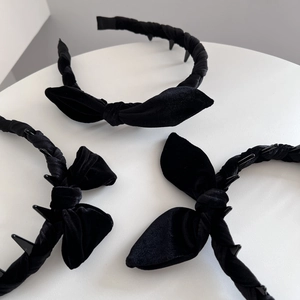 Three vintage black velvet bow headbands with inner teeth for non-slip hair styling