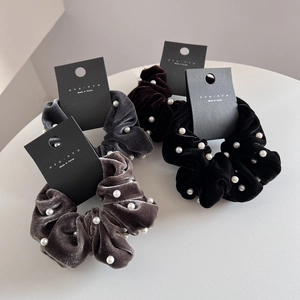 Elegant velvet hair scrunchies with pearls in black, brown, grey, and taupe tones