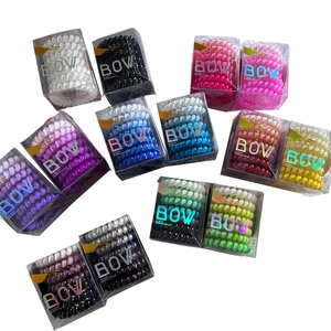 Eco-friendly TPU spiral hair ties in colorful gradient shades with a transparent box