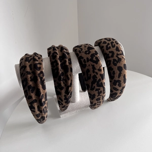 Set of four leopard print suede headbands in brown and black with a stylish padded design