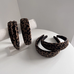 Leopard print headband set in faux suede featuring thick sponge style and twist design