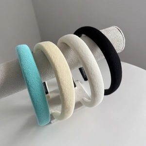 Chic padded fabric headbands in four colors featuring a textured ribbed finish