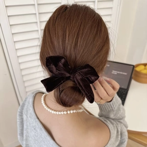 Elegant black velvet bow hair tie and pearl necklace set in French chic aesthetic