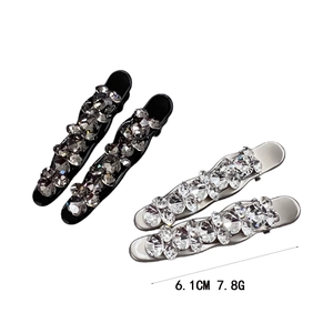 Sparkling crystal hair clips set in black and silver finishes measuring 6.1 cm long