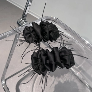 Elegant set of black satin hair clips featuring delicate feather trim in Korean style