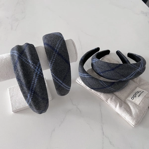 Elegant grey plaid wool headband with padded design for a stylish high crown look