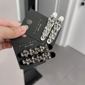 Detailed macro view showing the sparkling rhinestones on these elegant hair clips