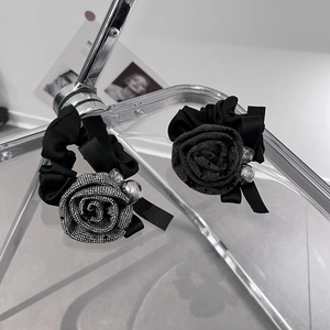 Elegant rose hair ties with fabric petals and sparkling crystal accents in a 2-piece set
