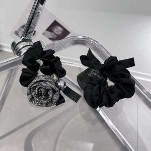 Elegant black fabric rose hair scrunchie set with rhinestones and handmade ribbon detail