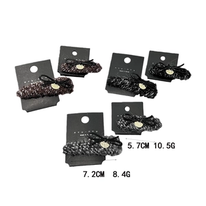 Set of autumn winter knit hair claws with black bows and heart charms in assorted colors