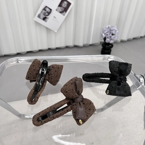 Elegant Korean style bow hair clips in brown and black knit fabric with polka dots