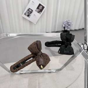 Elegant knit bow hair clips in coffee and black with golden Love charm details