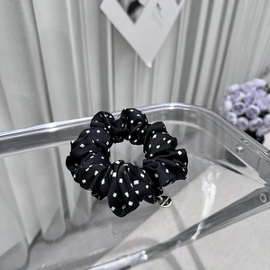 Retro black polka dot satin headband with a golden handmade metal charm for women
