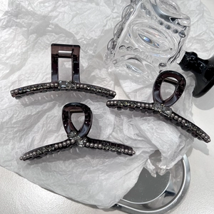 Three-piece set of purple crystal pearl shark hair clips with luxury rhinestone accents