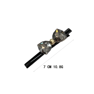 Sparkling crystal bow hair clip in black finish with 7cm length and minimalist design