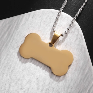 Golden bone shaped stainless steel pendant necklace with silver bead chain link