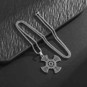 Silver stainless steel Celtic cross pendant necklace with engraved sun and knot motifs