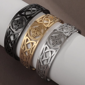 Hollow stainless steel C-shaped open bracelets in black, gold, and silver finishes