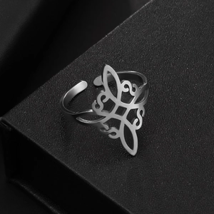 Macro detail of silver stainless steel Celtic knot open ring on a black display box