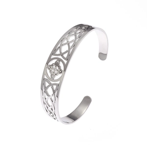 Detailed macro view of the silver C-shaped Celtic knot pattern on this stainless steel cuff