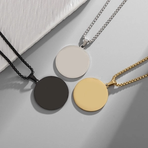 Minimalist stainless steel circular pendant necklaces in black, silver, and gold finishes