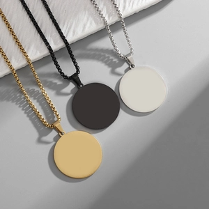 Detailed view of round minimalist stainless steel pendant necklaces in gold, silver and black