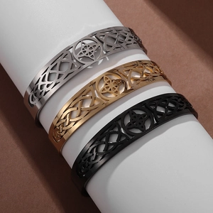Celtic knot cutout stainless steel open bracelets in silver, gold, and black finishes