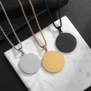 Detail of round minimalist necklaces in gold, silver and black with box chain