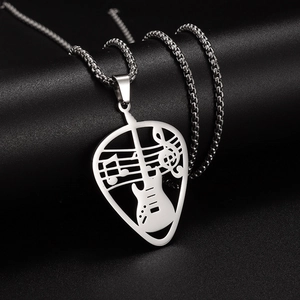 Detail shot of a silver hollow guitar pendant with musical notes and a box chain