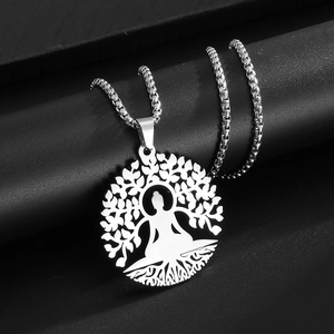Detail showing the silver Tree of Life and Buddha pendant with hollow engraved metal