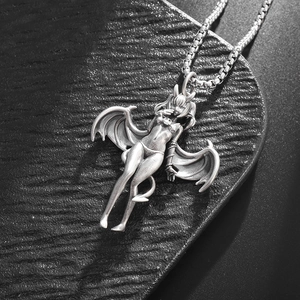 Detailed close-up of a silver devil girl pendant with wings on a classic box chain