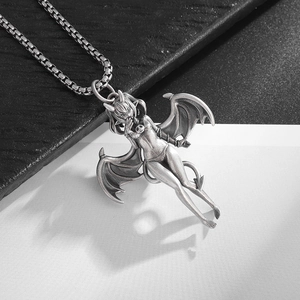 Detailed close-up of a vintage bat girl pendant with wings on a square link chain
