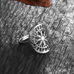 Macro shot of silver stainless steel adjustable ring with hollow snowflake pattern