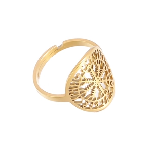 Close-up of golden Viking compass ring with intricate cutout patterns and adjustable band