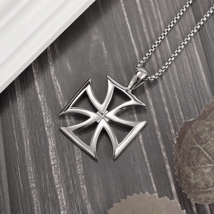 Polished silver hollow cross pendant with box chain on dark wood grain background