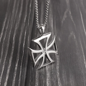 Detailed macro shot of a polished hollow cross pendant on a sturdy round box chain