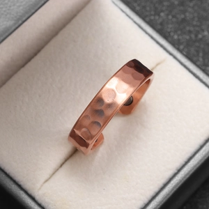 Adjustable rose gold copper ring with hammered texture and magnetic therapy stone inlay