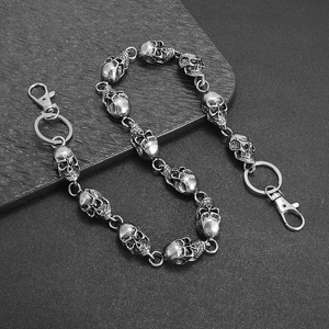 Detail of punk style skull link trousers chain with silver finish and lobster clasps