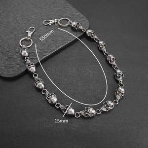 Macro shot of a 550mm punk skull trouser chain with vintage silver finish and lobster clasps