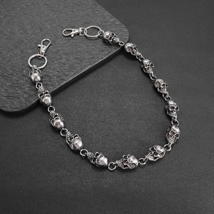 Detailed view of punk style skull link trousers chain with vintage silver finish