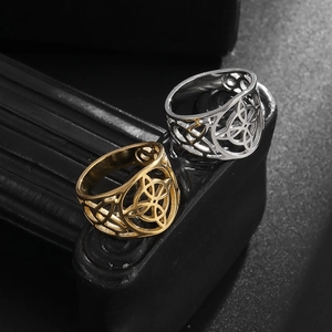 Set of two vintage hollow Celtic Knot rings in gold and silver stainless steel