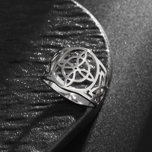 Macro view of vintage Celtic knot cut-out ring with polished silver steel finish