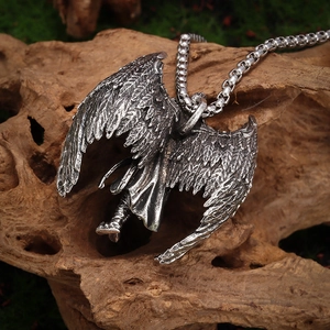 Macro shot of Archangel Michael wing pendant with antique silver finish and feather detail