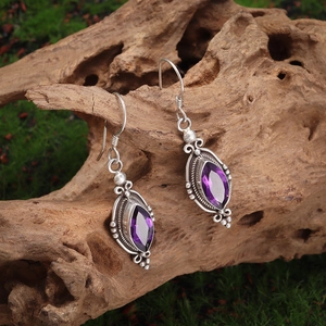 Detail view of purple amethyst teardrop earrings with S925 sterling silver ear hooks