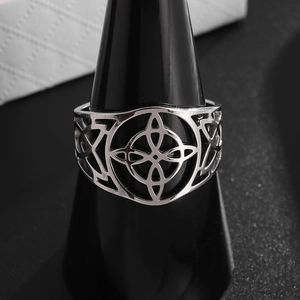 Vintage stainless steel witch's knot ring with intricate hollow geometric pattern design