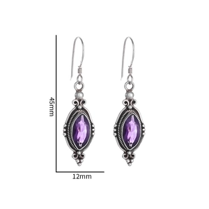 Detailed view of vintage silver earrings with marquise-cut purple amethyst stones