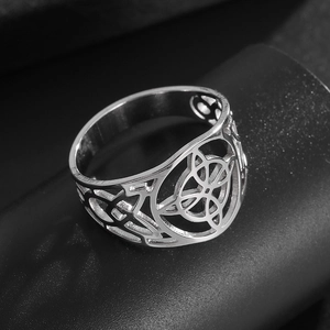 Detailed view of hollow vintage Celtic knot design on a wide stainless steel band