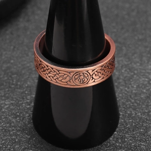 Vintage copper plated wide band ring with Celtic knot patterns and antique finish