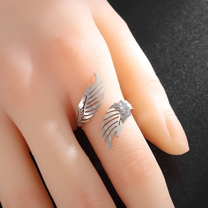 Adjustable minimalist stainless steel angel wing open ring with a polished silver finish