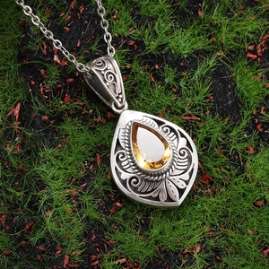 Vintage alloy necklace with pear-cut citrine gemstone and antique floral patterns